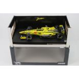 A 1:18 scale Hot Wheels Jordan F1 racing EJ10 (Heinz Harald Frentzen) in original box.