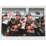 A laminated photo signed Daniel Ricciardo and Max Verstappen.