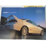 A collection of Renault, VW, Honda, BMW, Ford and Subaru advertising pamphlets,