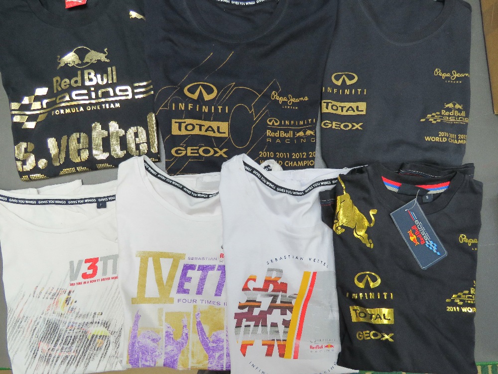 Seven assorted F1 racing t-shirts including; Vettel 2010, Red Bull 2011, etc.