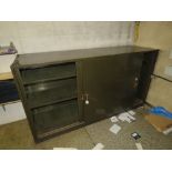 A large steel sliding door cabinet havin