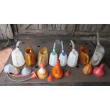 A quantity of assorted oil jugs and funn