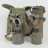 Two WWII Slovakian Military gas masks with German made filters; one within can,