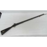 An early 19th century percussion gun with walnut stock and brass banding, with ram rod,