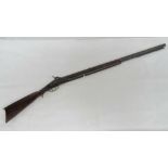 An antique .35 calibre percussion rifle with double set triggers and heavy octagonal barrel.