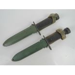 Two Vietnam War period US M16 rifle bayonets in M8 scabbards with M66 webbing.