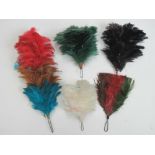 Five assorted dyed feather military hat plumes.