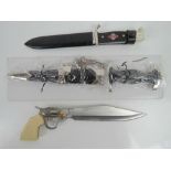 Two reproduction WWII German daggers; one ceremonial chained SS, the other a Hitler Youth knife.