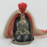 A 19th century leather Cambridge Yeomanry helmet having short red front plume and red and white