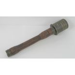 An inert WWII German Infantry issue 'Potato Masher' stick grenade dated 1939 with porcelain pull