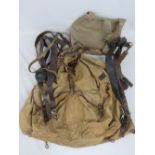 WWII German Infantry webbing/bread bag/straps including Y straps, chin straps and a 1942 rucksack.