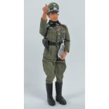 A scale model Action Man type doll in full WWII German Officer dress complete with Map, Peaked Cap,