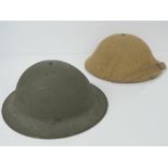 Two WWII British 'Tommy' helmets; one with WWI style Brodie liner,