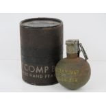 An American Vietnam War period M67 'Baseball' grenade in original stores pot.