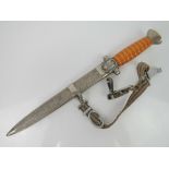 A rare WWII German Red Cross Leaders dagger with hanging straps and original scabbard.