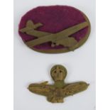 An RAF flying eagle badge with crown over, together with a brass Gliders badge. Two items.