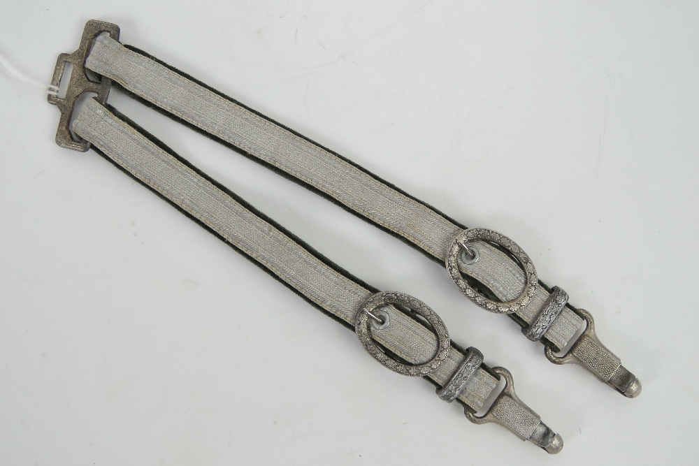 A pair of WWII German Army Officers dagger hangers complete with buckles, approx 28cm in length.