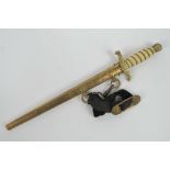 A WWII German Naval Officers dagger complete with velvet hanging strap and double lion mask buckle,