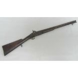 A short percussion gun with walnut stock having impressed crown with 227 over to side plate,