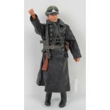 A scale model Action Man type doll in full WWII German SS Officer dress complete with full length
