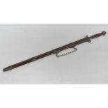 An early 20th century decorative double edged samurai sword having embossed brass decoration