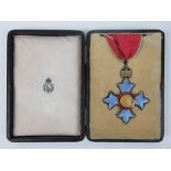 A rare British CBE Commander of the British Empire medal complete with black leatherette issue box