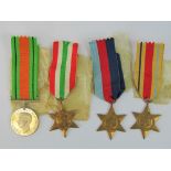 A set of WWII British military medals including; 1939-45 Star, Defence, Africa Star and Italy Star,
