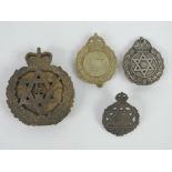 Four assorted military badges each bearing the Jewish Star of David upon.