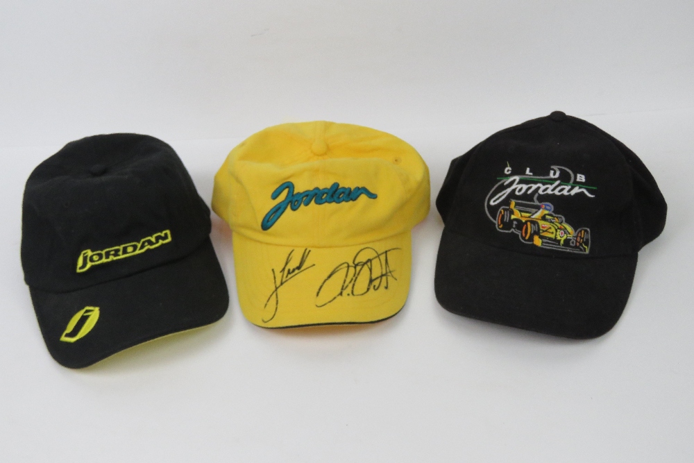 Three Jordan GP Racing caps, one signed