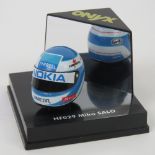 A Mika Salo boxed mini helmet bearing si
