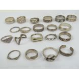 Twenty-one assorted silver rings including 925 silver band with Roman numeral design upon,