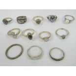 Twelve assorted silver rings including; 875 Russian Niello work ring, mother of pearl, marcasite,