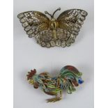 An 800 silver filigree brooch in the form of a cockerel having multi-coloured enamel upon, 3.