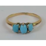 A 10ct gold and turquoise three stone ring,