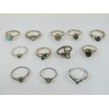 Twelve silver rings set with green and blue stones including; turquoise, peridot, moonstone, etc,