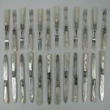 A set of twelve HM silver engraved desert knives and forks bearing Sheffield hallmarks and having