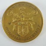 A 10ct gold McMaster University Canada medal having crest and motto in Greek upon (All things