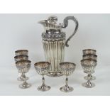A good silver carafe and goblet set in the Classical style,