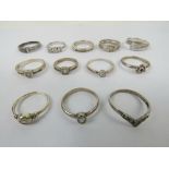 Twelve silver rings set with white stones including 925 three stone ring, 925 eternity ring, etc,