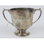 A heavy HM silver twin handled trophy cup engraved 'W. A.