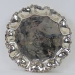 A 925 Mexican silver salver having bulbous convex decoration to the rim and monogrammed CK to