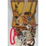 A quantity of assorted vintage costume jewellery including faux pearls, bead necklaces, brooches,