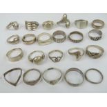 Twenty-two assorted silver rings including Hallmarked silver wide band, silver signet rings,