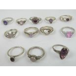 Twelve silver rings set with assorted pink and purple stones including rose quartz and amethyst, 30.