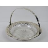 A sterling silver and cut glass bonbon basket having swing handle over, marked Sterling 925, 13.