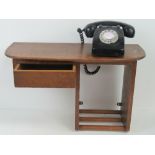 A vintage oak offset wall mounted teleph