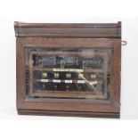 A vintage oak cased fire alarm panel bea