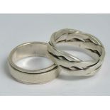 Two mens silver rings, one with rotating