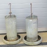 A pair of vintage chicken feeders with h