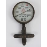 A brass oxygen safety gauge registering